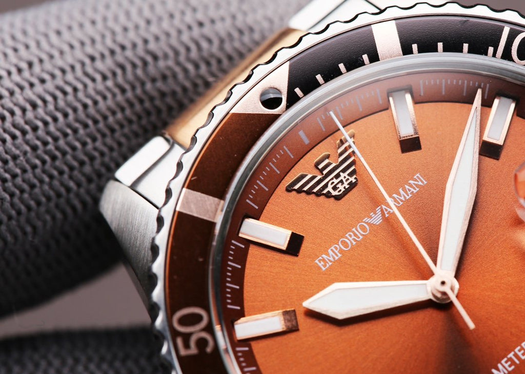 EMPORIO ARMANI Orange Dial Two-Tone Watch — detail