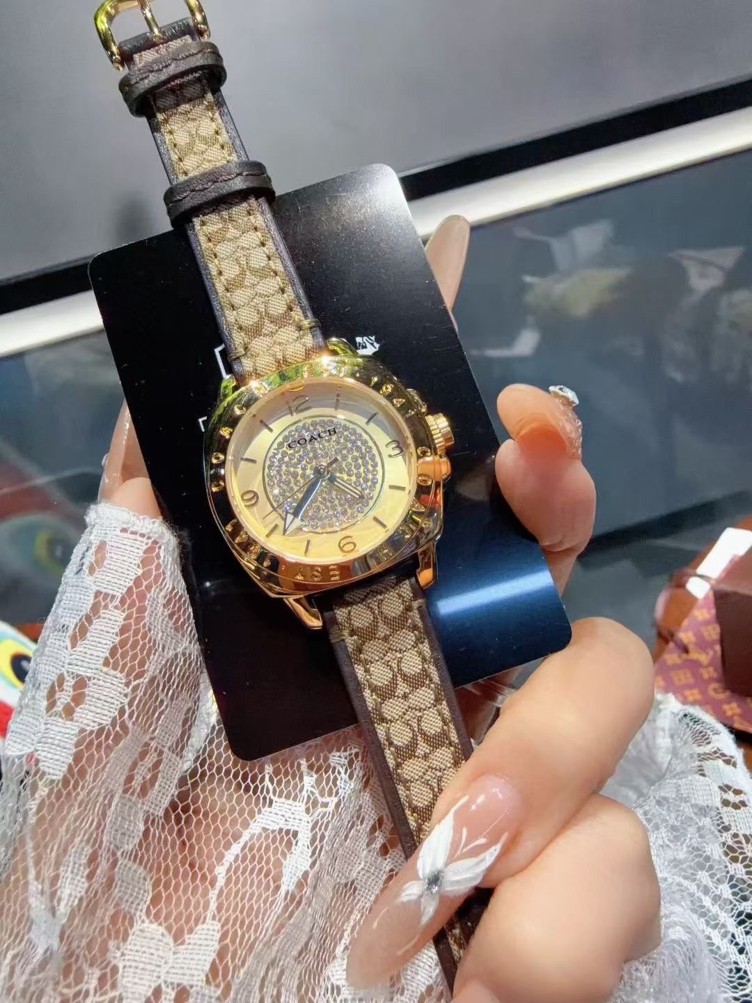 Coach Gold-Tone Patterned Strap Watch — hero